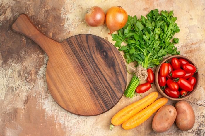 wood cutting board with vegetables