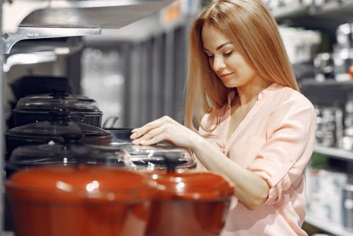 A woman purchasing cookware